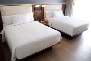 Postel nebo postele na pokoji v ubytování Courtyard by Marriott Puebla Las Animas