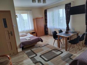 Postel nebo postele na pokoji v ubytování Pokoje Goscinne Bartosz