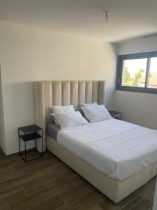 Postel nebo postele na pokoji v ubytování Villa Jasmine