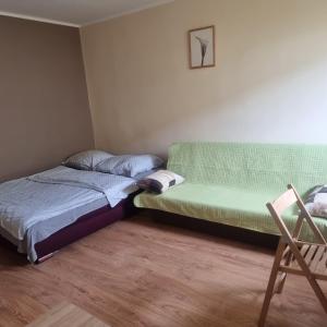 Posteľ alebo postele v izbe v ubytovaní Apartament na Przymorzu