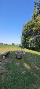 a park with a picnic table and a bench at Noclegi u Eli Zator Energylandia in Zator