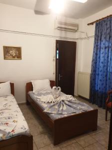 Postel nebo postele na pokoji v ubytování Aliki