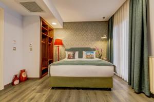 Postel nebo postele na pokoji v ubytování Sometimes Hotel Taksim