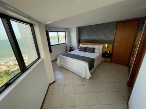 Katil atau katil-katil dalam bilik di Suites Natal Plaza +11 gambar