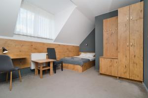 Postel nebo postele na pokoji v ubytování Kazimierzówka