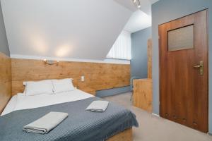 Postel nebo postele na pokoji v ubytování Kazimierzówka