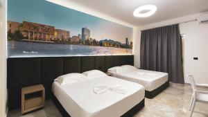 Postel nebo postele na pokoji v ubytování Hotel Ruko Boutique