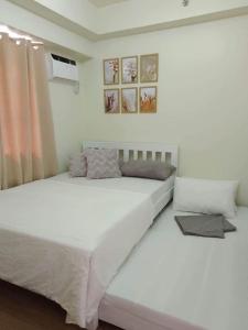 Ένα ή περισσότερα κρεβάτια σε δωμάτιο στο Brixton place near bgc