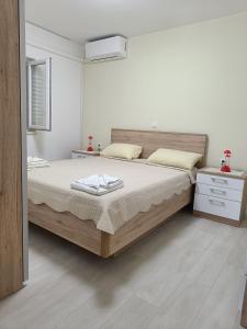 Postel nebo postele na pokoji v ubytování Apartments Vukas