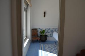 Posezení v ubytování B&B Fuga al Trullo