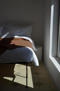 Postel nebo postele na pokoji v ubytování B&B Fuga al Trullo
