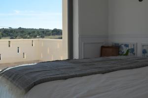 Postel nebo postele na pokoji v ubytování B&B Fuga al Trullo