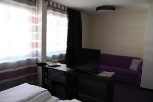 Postel nebo postele na pokoji v ubytování Amiga Hotel München Messe