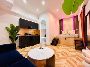 a living room with a couch and a table at Seabnb - Intimate Escape - 2 Min to Tram & Beach in Nice