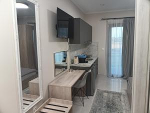 TV a/nebo společenská místnost v ubytování Zathay Apartments
