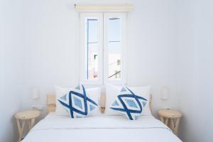 Postel nebo postele na pokoji v ubytování Eleanna's Mykonos