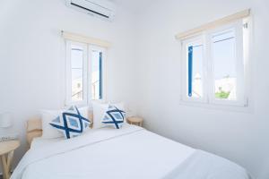 Postel nebo postele na pokoji v ubytování Eleanna's Mykonos