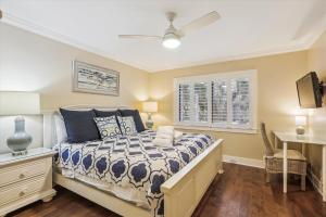 a bedroom with a bed and a window at 2319 Racquet Club in Hilton Head Island +39 photos