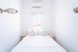 Postel nebo postele na pokoji v ubytování Eleanna's Mykonos