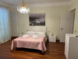 Łóżko lub łóżka w pokoju w obiekcie Hotel Villa De Santis