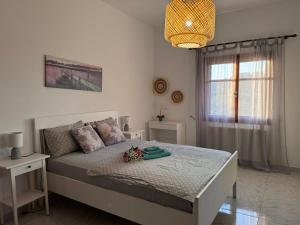 Postel nebo postele na pokoji v ubytování Fousa Home