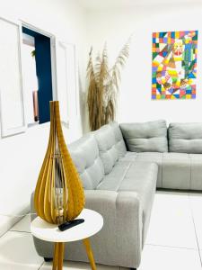 a living room with a couch and a table at Hostel Recanto da Paciência in Salvador