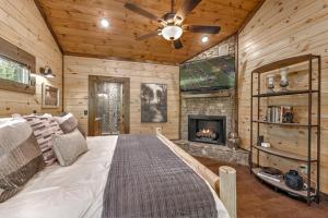 a bedroom with a large bed and a fireplace at Friends in High Places in Blue Ridge
