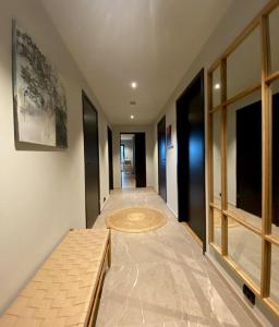 a hallway of a house with a rug on the floor at Modern Apartment close to Leknes in Leknes
