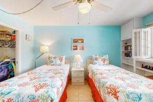 Ένα ή περισσότερα κρεβάτια σε δωμάτιο στο Sweet Beach Retreat