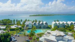an aerial view of a resort near the ocean at Atoumo piscine citerne in Le Gosier