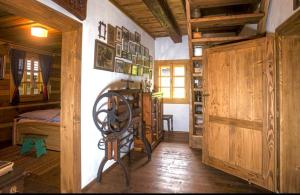a room with a chair and a bed in a house at Chalupy Pod Šenkem - Chalupa in Vsetín