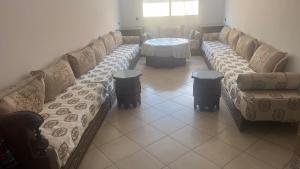 a living room with a couch and a table at martil in Martil