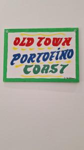 a sign on a wall that reads old town puerto prodigiousoss at Old Town Portofino Coast in Rapallo +20 photos