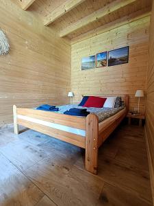 Postel nebo postele na pokoji v ubytování Domki Sielankowo