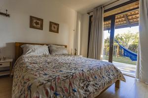 Ένα ή περισσότερα κρεβάτια σε δωμάτιο στο Refúgio charmoso cercada por verde