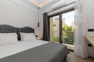 Voodi või voodid majutusasutuse Zante Center Suite A toas