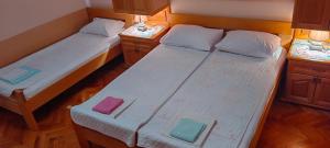 Postel nebo postele na pokoji v ubytování Apartmani Milicevic