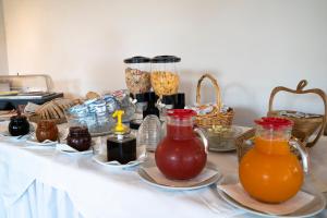 a table with food and drinks on top of it at Park Hotel Cilento in Marina di Camerota