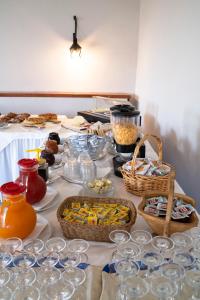a table topped with bowls and baskets of food at Park Hotel Cilento in Marina di Camerota