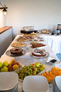 a long table filled with different types of food at Park Hotel Cilento in Marina di Camerota