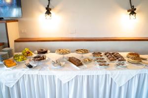 a table with many different types of desserts on it at Park Hotel Cilento in Marina di Camerota