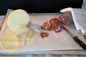 a cutting board with apples and a knife on it at Park Hotel Cilento in Marina di Camerota