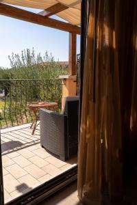 a window with a view of a patio with a table at Park Hotel Cilento in Marina di Camerota