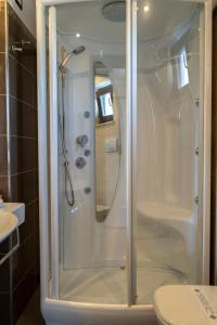 a glass shower in a bathroom with a toilet at Park Hotel Cilento in Marina di Camerota
