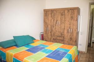 Ένα ή περισσότερα κρεβάτια σε δωμάτιο στο Apto Praia Grande (Guilhermina)