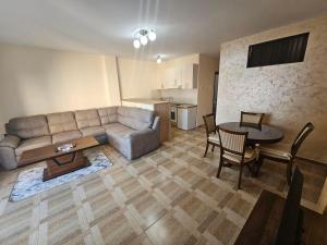 a living room with a couch and a table at Luka Apartments in Bečići