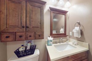 a bathroom with a sink and a mirror at Timberline Chalet in Breckenridge +17 photos