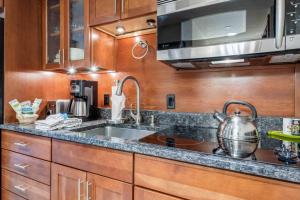 a kitchen with a sink and a pot on the counter at Lodge at Lionshead 280 in Vail
