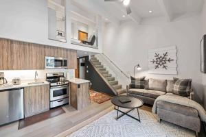 a kitchen and living room with a couch and a table at Lodge at Lionshead 320 in Vail