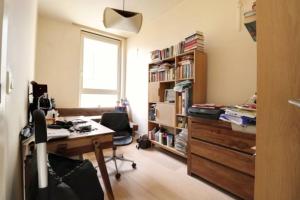 an office with a desk and a book shelf at Apartment mit 4 zimmer nahe Düsseldorf-Centre in Düsseldorf